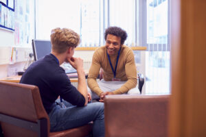 Young man meeting with a counsellor.