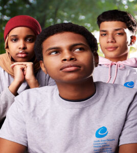 three youths from seochc posing for portraits