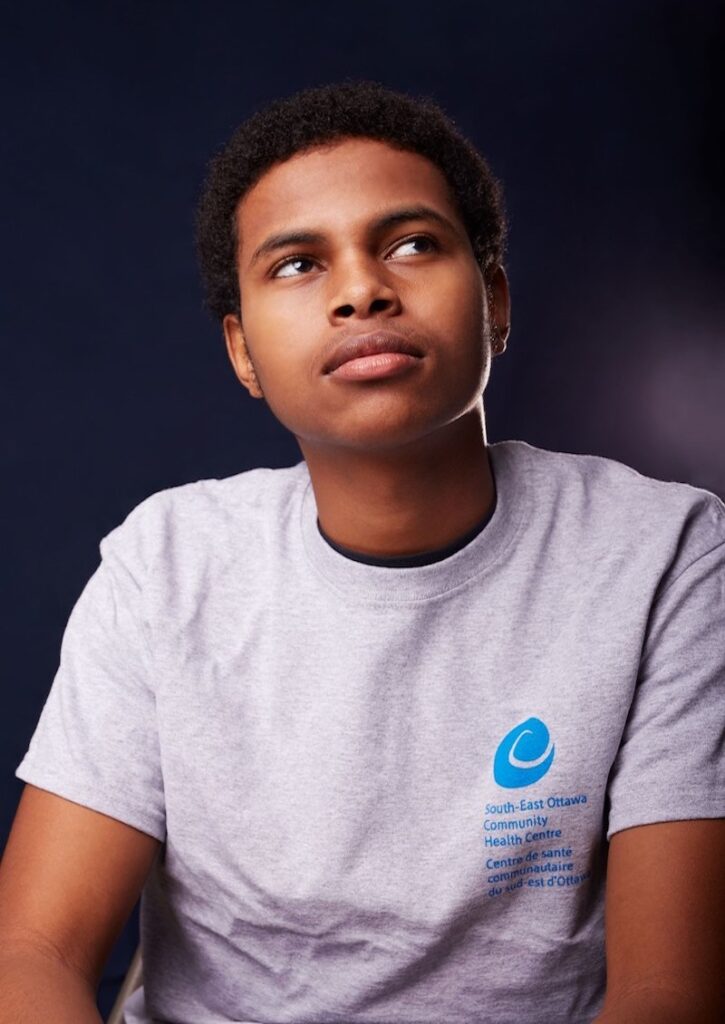 Boy staring up into the distant right.