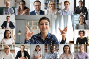 Video conference call with multiple users visible on screen.