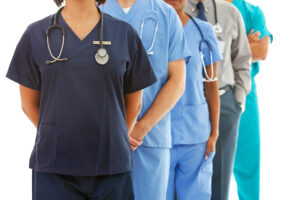 Unidentified medical professionals standing in line.