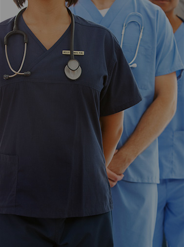 Unidentified medical professionals standing in line.