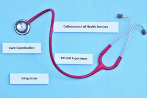 Red stethoscope wrapped around adhesive tags labeled with text.