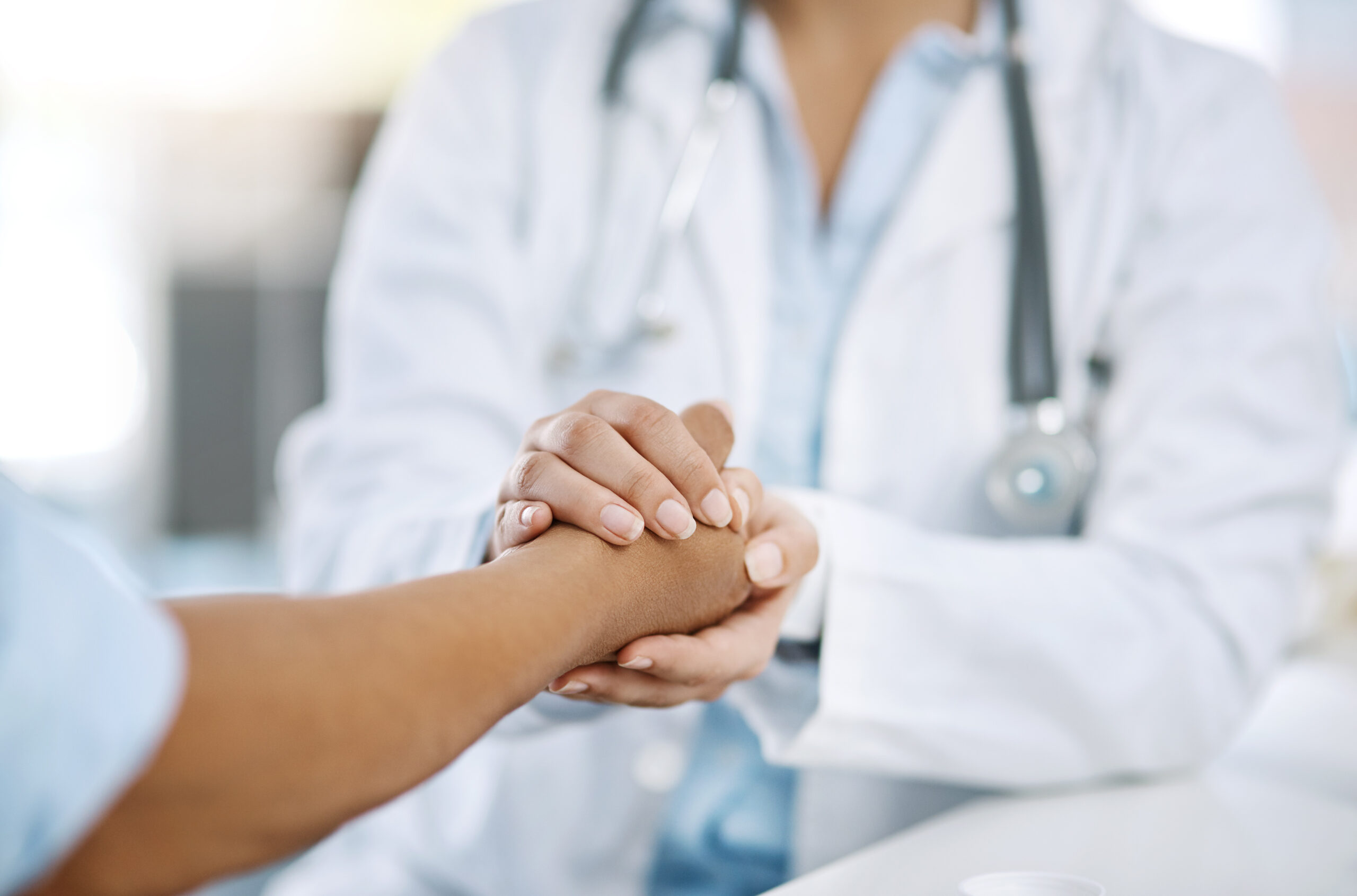 Doctor Holding Patient's Hands